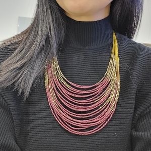 Maroon/brass beaded necklace